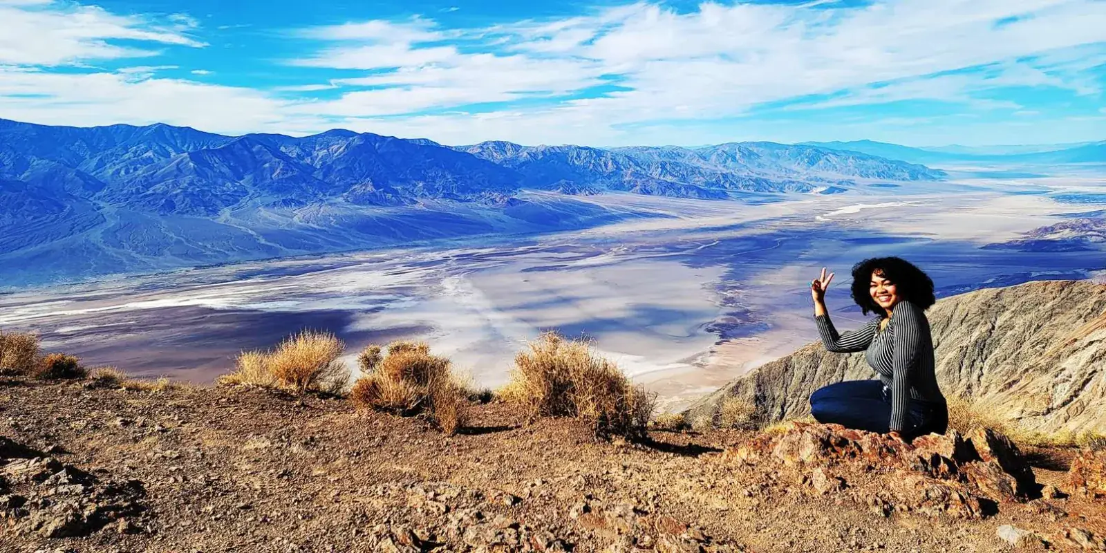Visitor overlooking a desert valley