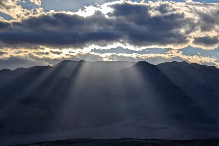 Cloud shadows over desert hills